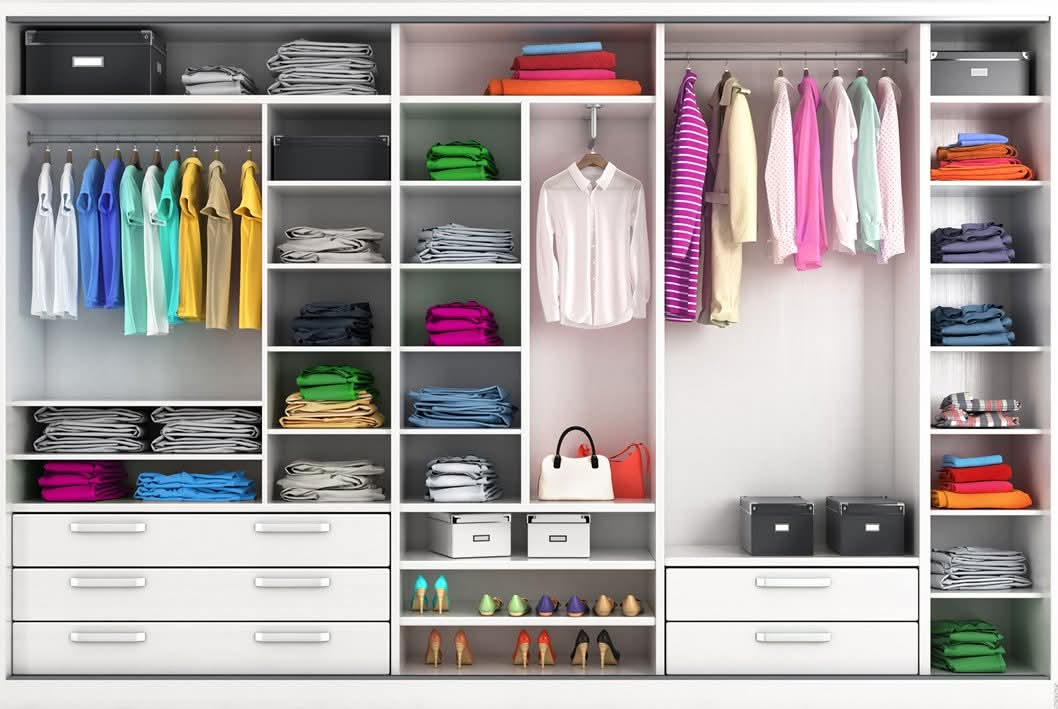 Neatly organised wardrobe with folded clothes and shoes